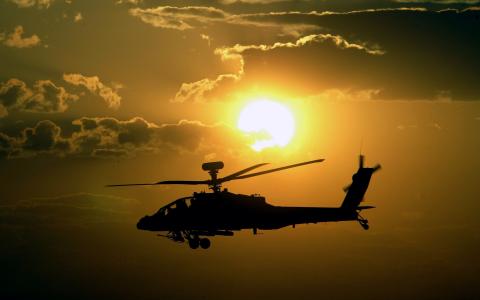 直升机，日落，天空，太阳，飞行，武器，阿帕奇