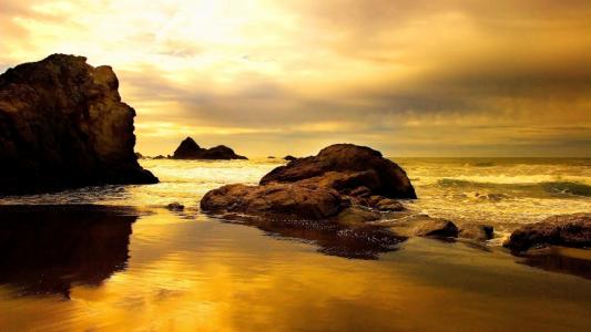 日落，海洋，石头，海滩